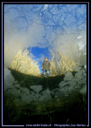 Sophie waiting for us.... Diving under the ice... close t... by Michel Lonfat 